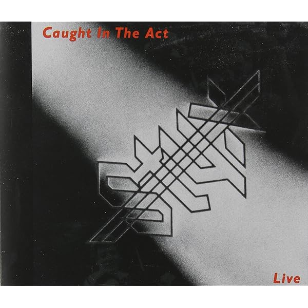 Amazon.co.jp: Caught in the Act: Live (Ac3 Dol): ミュージック